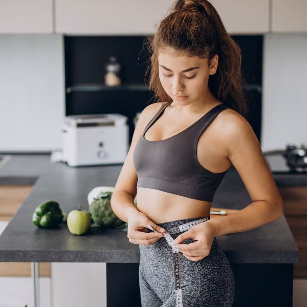 Woman preparing a healthy meal in her kitchen